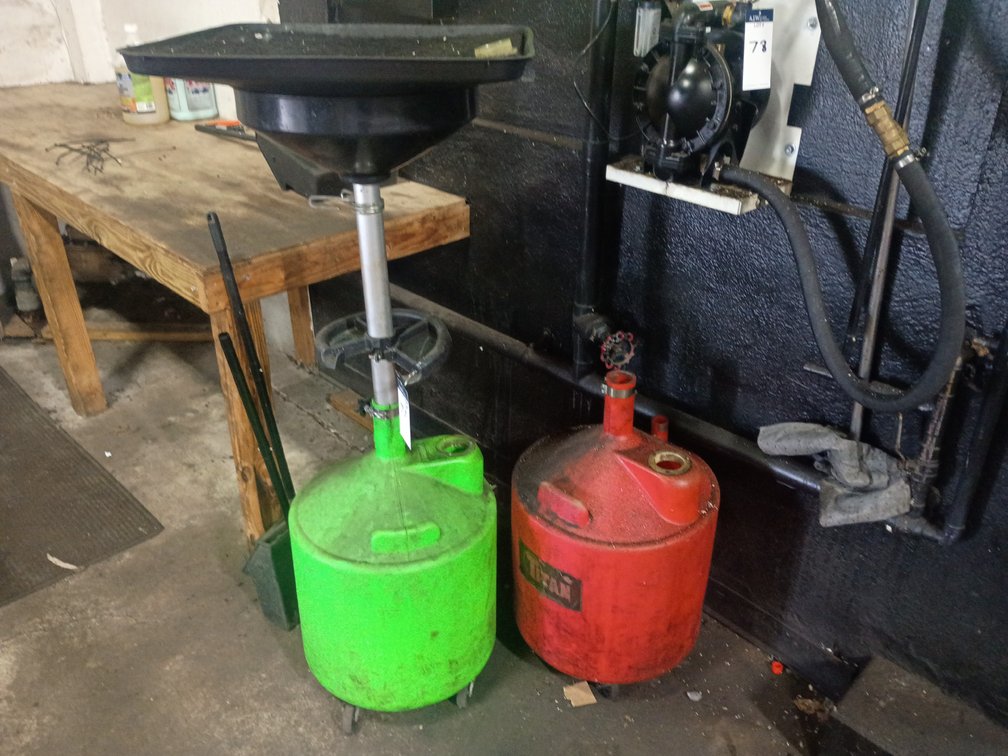 {each} Ass't Oil Drain Dollies
