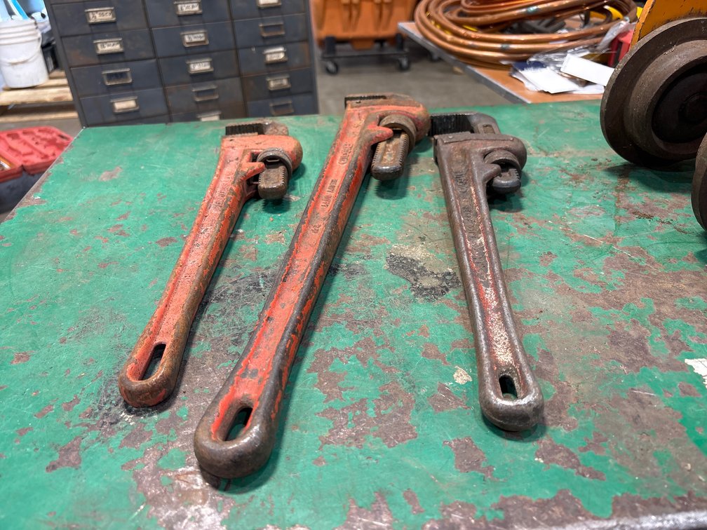 A Group of Ass't Size Steel Pipe Wrenches