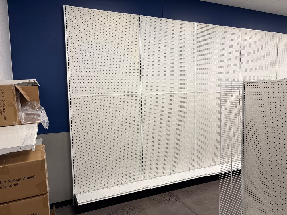 A Group of Pegboard-Wall Gondola Shelving Around Perimeter, 125" Tall