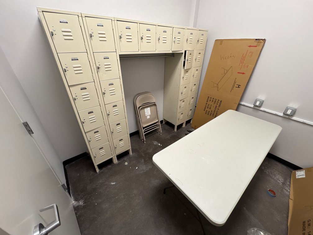 A Group of Steel Lockers, Folding Tables and Chairs