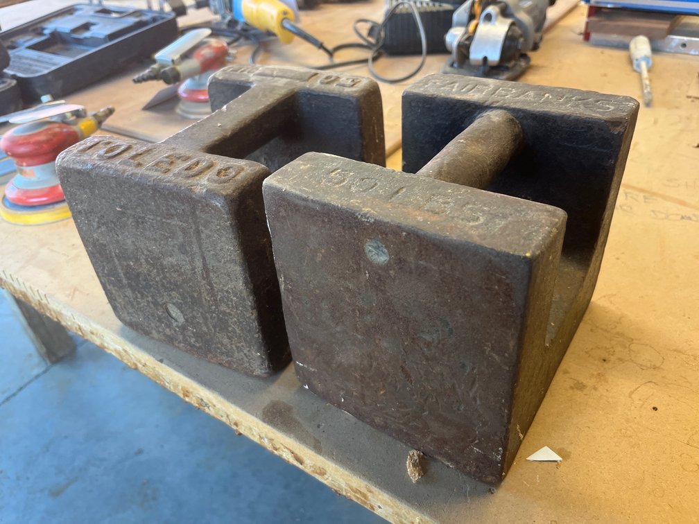 {each} Vintage Cast Iron 50lb Scale Weight