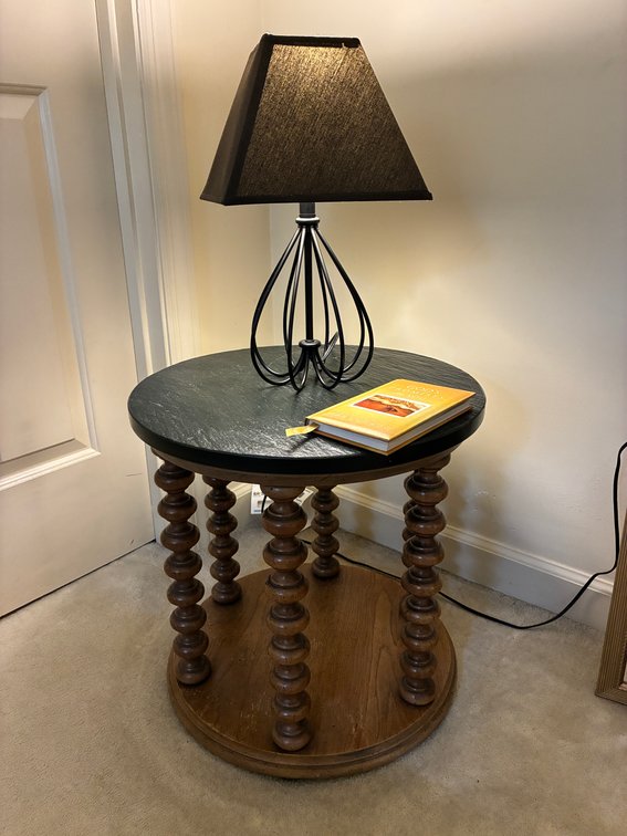 Wood Table, Black Metal Lamp, Book