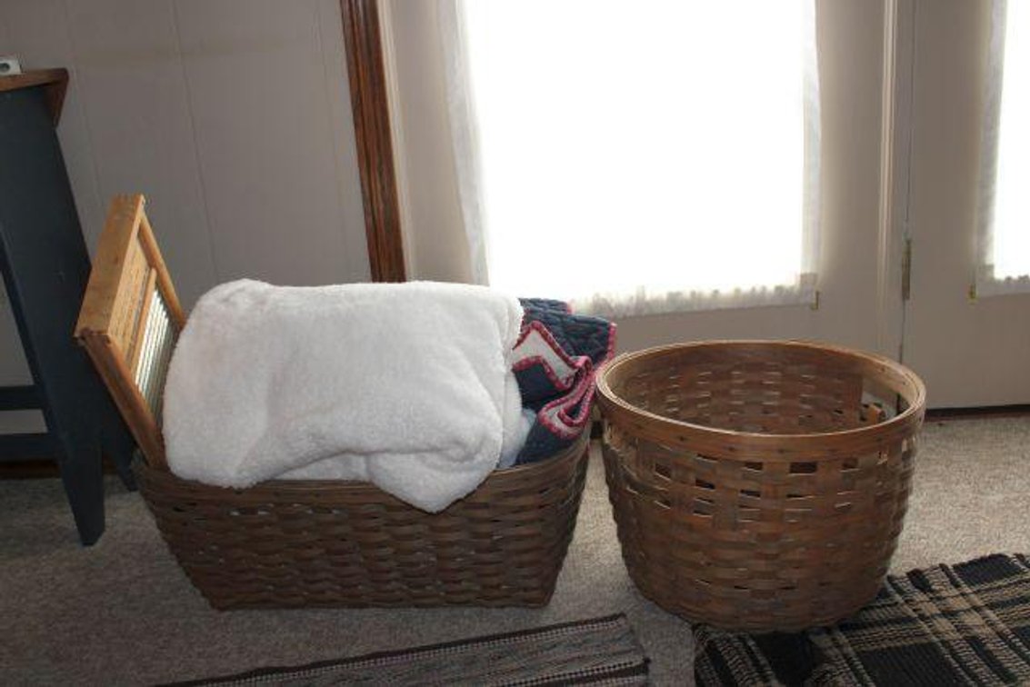 LONGABERGER LAUNDRY BASKET AND OTHER BASKET 