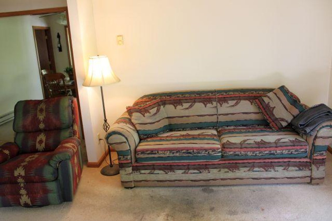 COUCH, RECLINER, LAMP, CLOCK