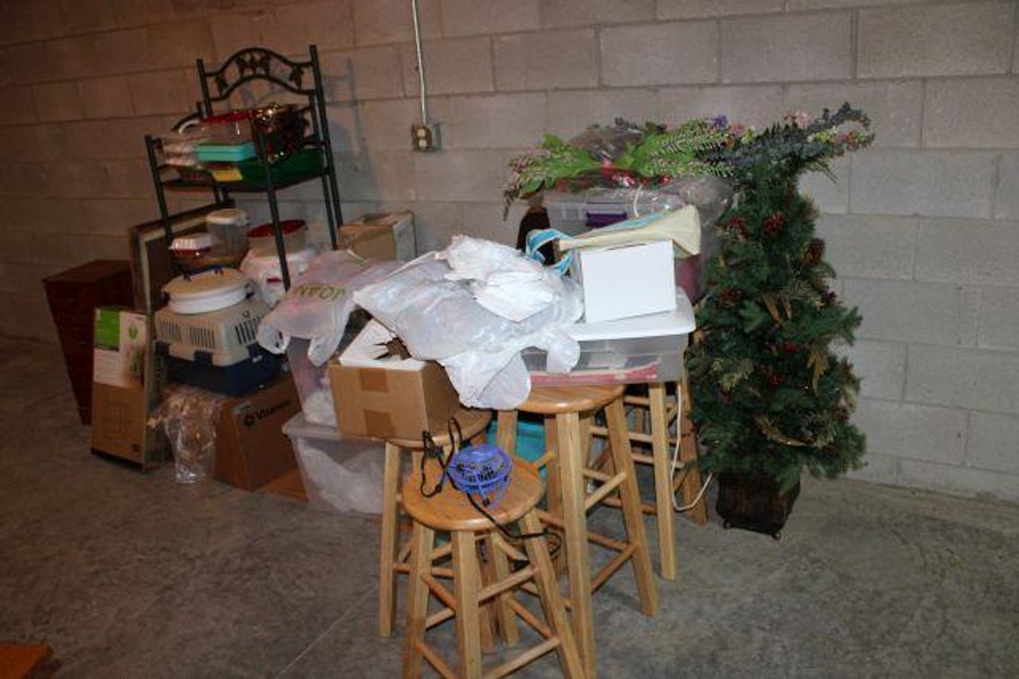 BASEMENT CONTENTS BETWEEN STAIRS AND WALL