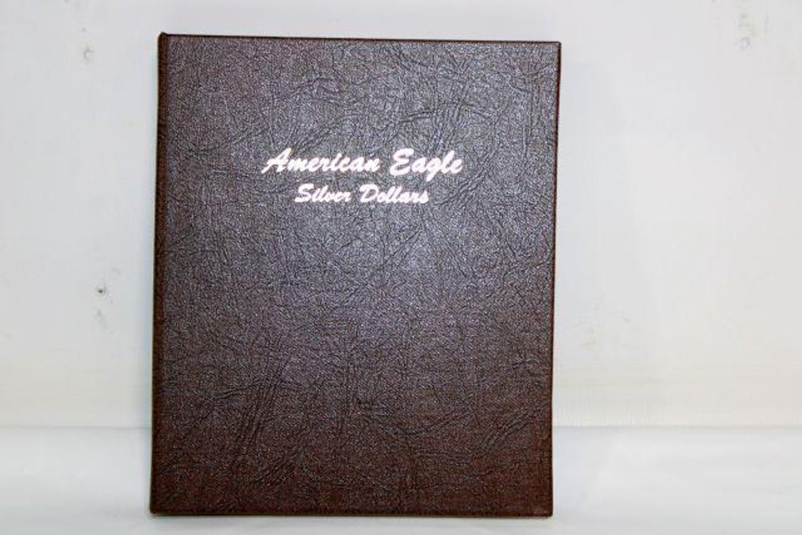 AMERICAN EAGLE SILVER DOLLAR BOOK W/ COINS