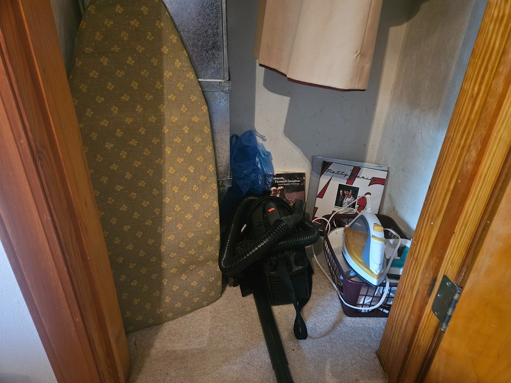 Middle Bedroom Closet Contents Irons - Vacuum - Books and More 