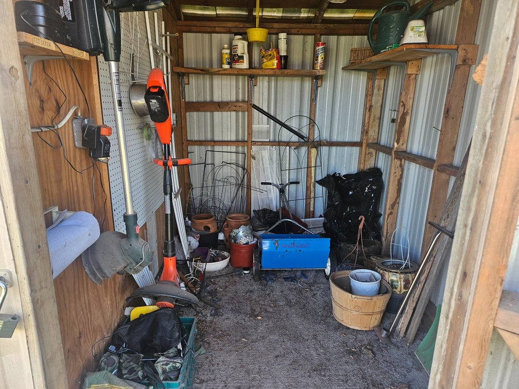 Middle Shed Contents Black and Decker Battery Powered Weedeater - Craftsman Battery Powered Weedeater - Spreader - Planters and More 