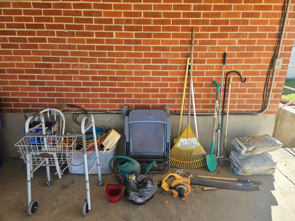 Carport Contents Lot Black and Decker Leaf Blower (Worked When Tested No Charger)) - Folding Chairs - Yard Tools - Extension Cords and More 