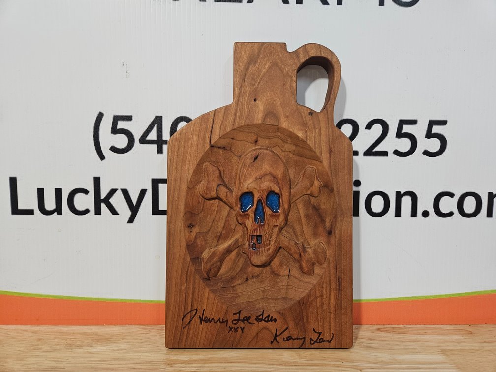Moonshiners Carved Wooden Liquor Jug W/Epoxy Autographed By Henry Lee Law and Kenny Law Off Of The Show Moonshiners - Measures 12.75" Tall × 7.75" Wide 