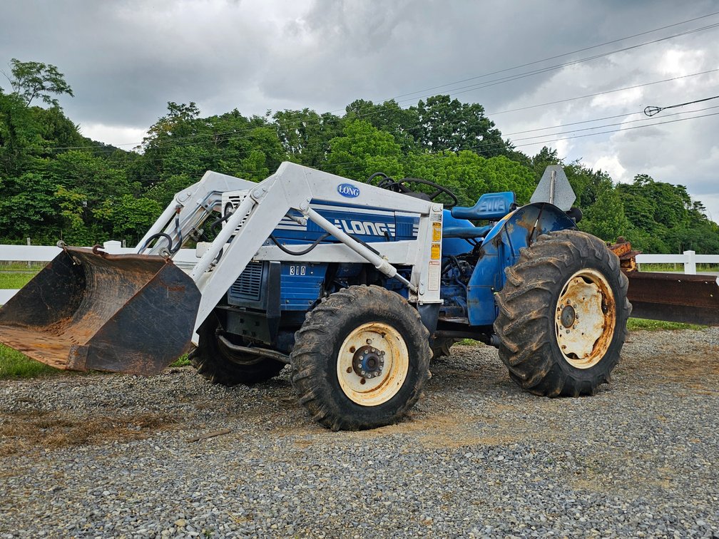 1985 Long 310 Tractor - 4x4 - 28HP w/ Loader and 6' Scraper Blade - Runs/Drives 