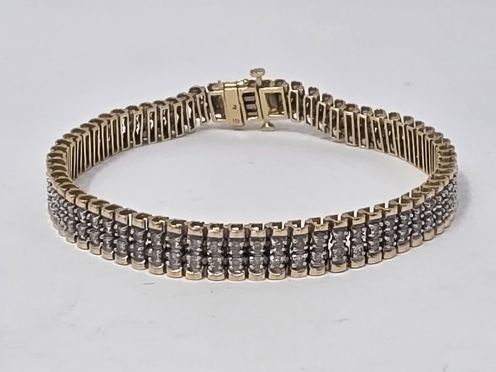 14-KT Double Row Diamond Line Bracelet - 7.25" Long x 7.15MM Wide - Round Full Cut Diamonds (136 Total) - .015 Carats Each (2.04 Carats Total) - Clarity I-1 to I-2 - Color: H-I - 16.2 Grams Total Weight