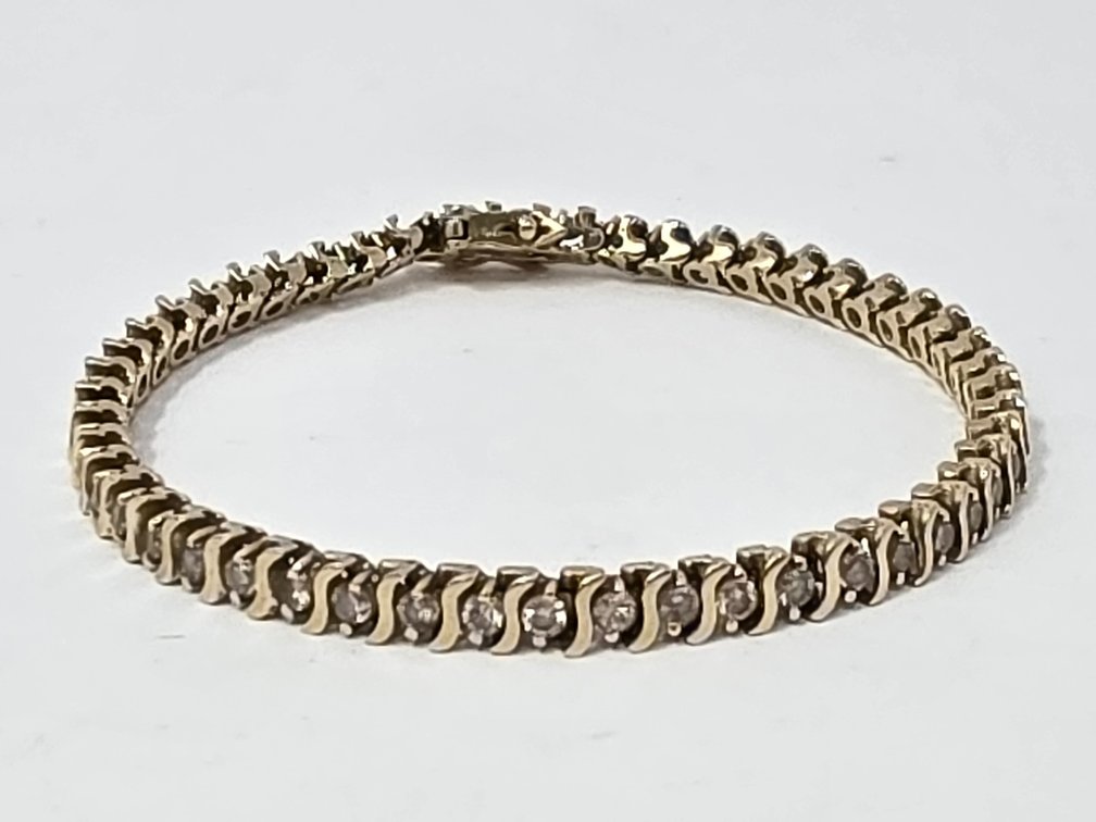14-KT S-Link Diamond Tennis Bracelet - Measures 7" Long x 4.65MM - Round Full Cut Diamonds - .05 Carats Each (51 Total) 2.55 Carats Total - Clarity I-1 - I-2 - Color: K-L - 12.9 Grams Total Weight
