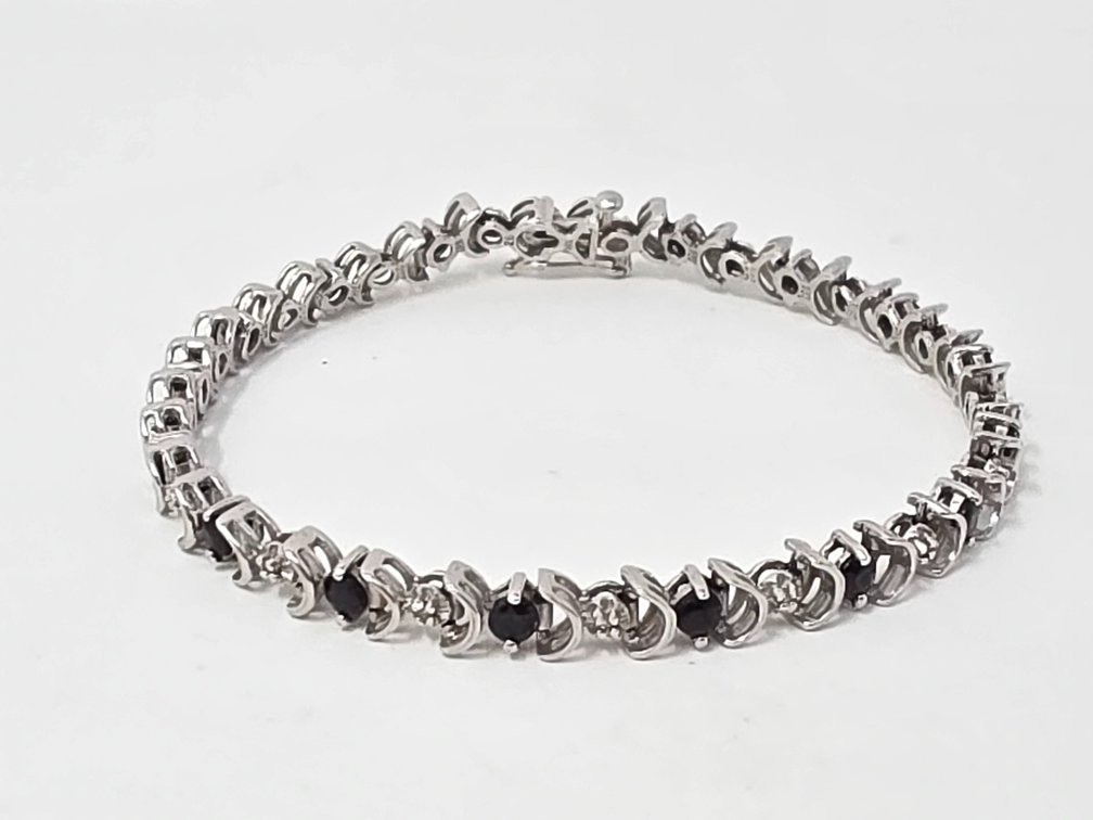 10-KT White Gold Sapphire and Diamond Tennis Bracelet - 7" Long x 5.20MM - Round Single Cut Diamonds .005 (Approx 1MM) Each (17 Total) .09 Carats Total - Clarity: SI-2 - I-1 - Color: I-J (Sapphire 2.55 Carats Total) 9.1 Grams Total Weight