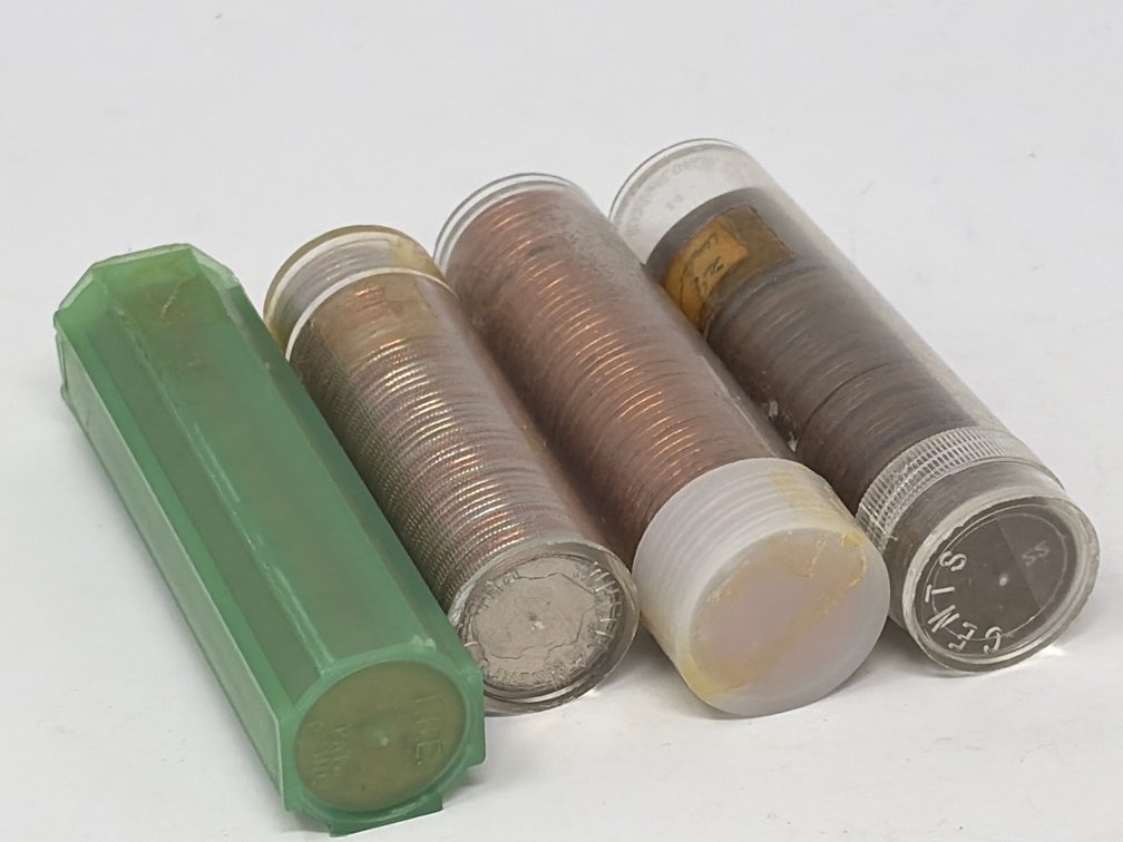 Four Plastic Coin Tubes with Coins