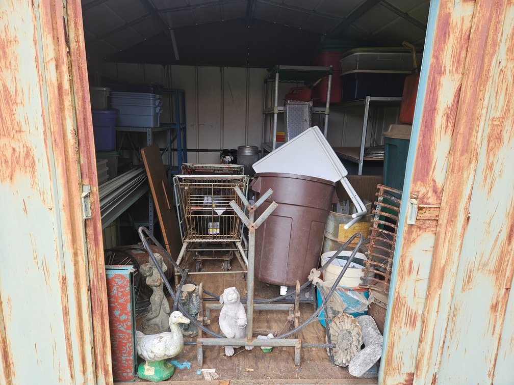 Back Yard Shed Contents Metal Shelves - Storage Totes - Yard Art and More 