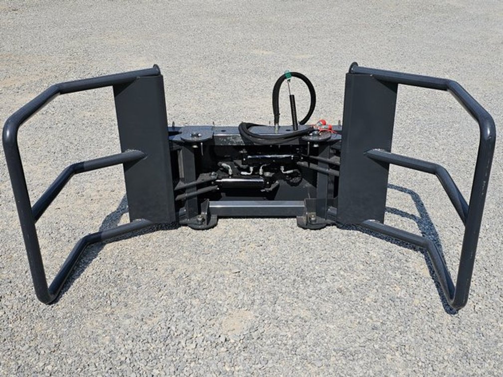 Unused Wolverine Adjustable Hydraulic Bale Squeeze Skid-Steer Quick Attach - BSH-12-75D