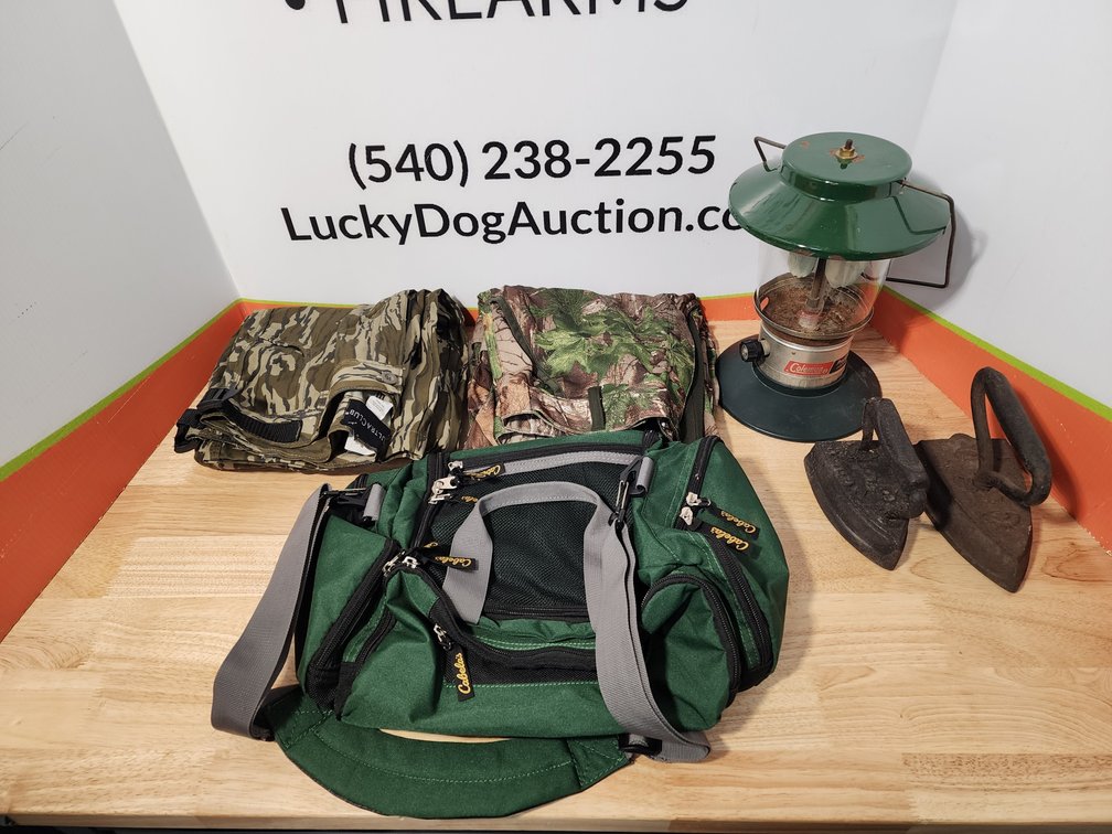 Cabelas Gear Bag - (2) Sad Irons - Coleman Propane Lantern  - Ultra Club Bottomland Pants Size 38 (Unused) - Redhead Camo Pants Size L( Unused) 