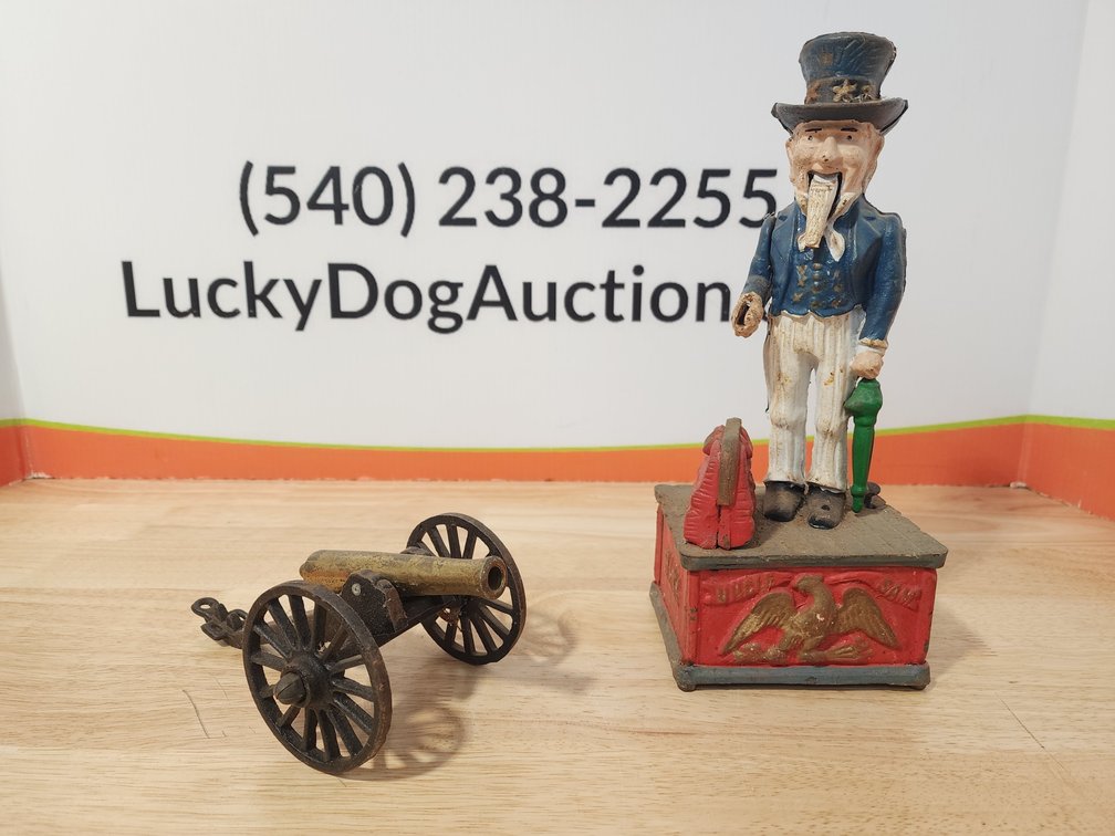 Uncle Sam Cast Iron Coin Bank Measures 11" Tall - Small Replica Cannon Measures 3" Tall 