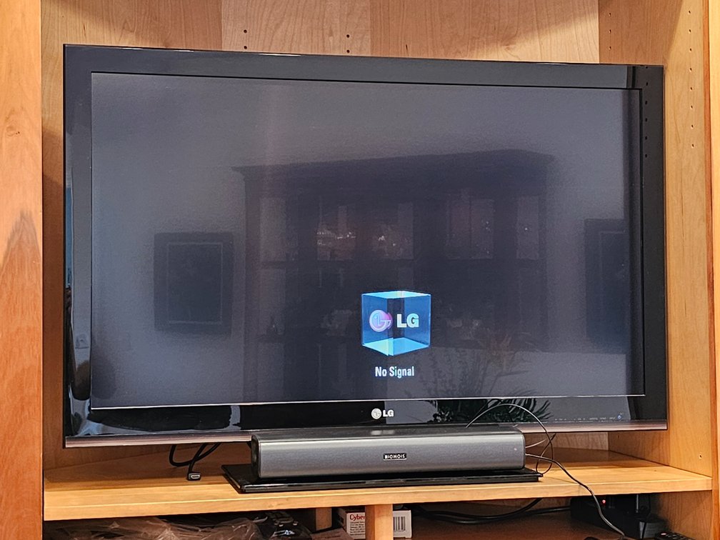 52" LG Flat-Screen Television and Riomois Sound - Both Remote Controls Included 