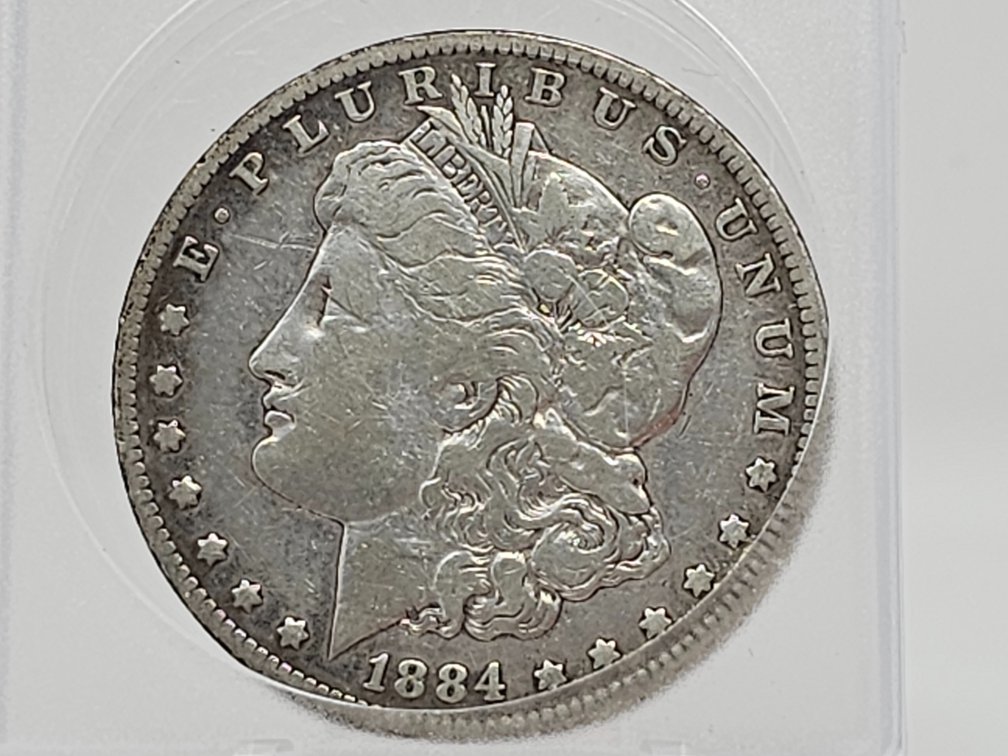 1884-O Morgan Silver Dollar w/ Capsule