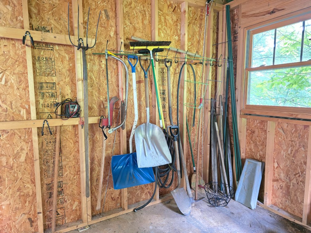Shed Contents Lot 1 - Yard Tools - Snow Shovel, Pitchfork, Saw, Broom, Battery Charger