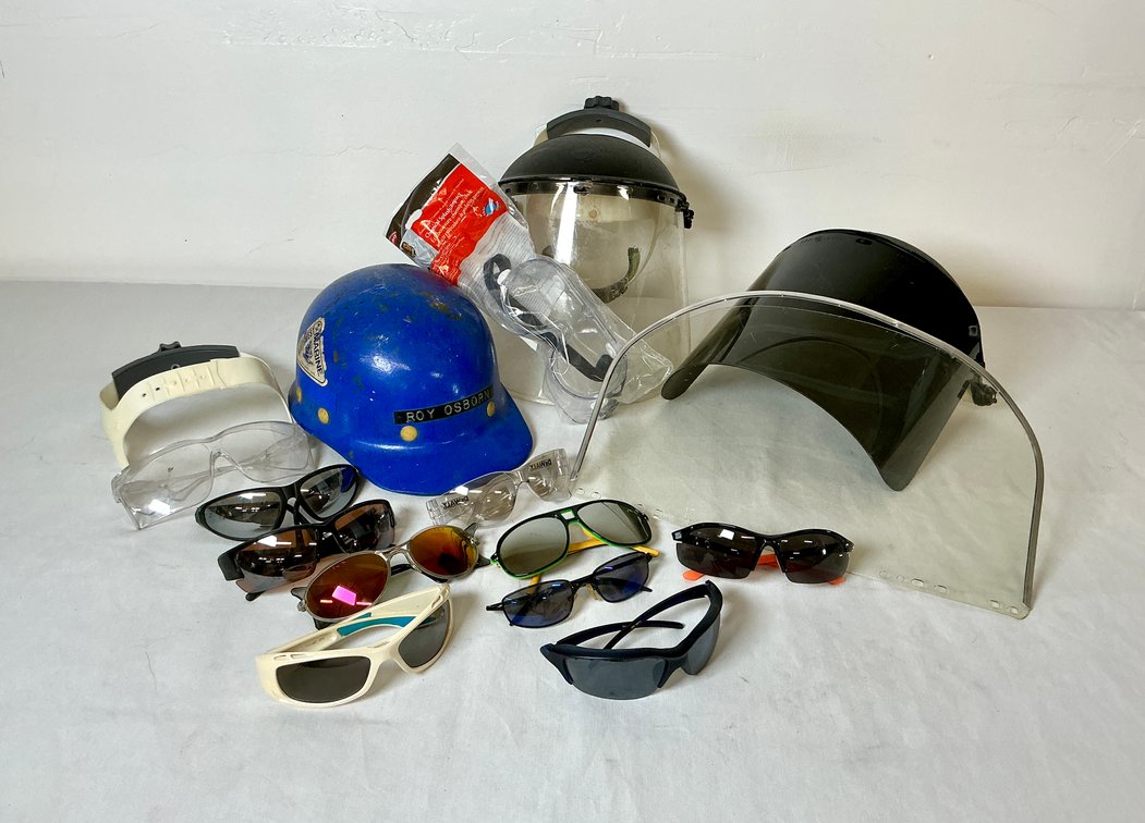 Protective Face Shields, Hard Hats, and Assortment of Sun Glasses and Safety Glasses