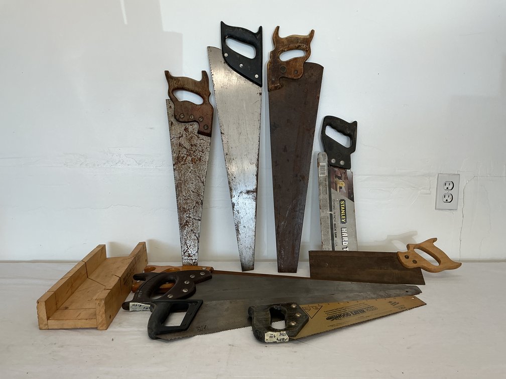 Assortment of Hand Saws and a Mitre Box