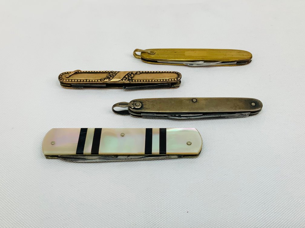Four Miniature Folding Pocket Knives