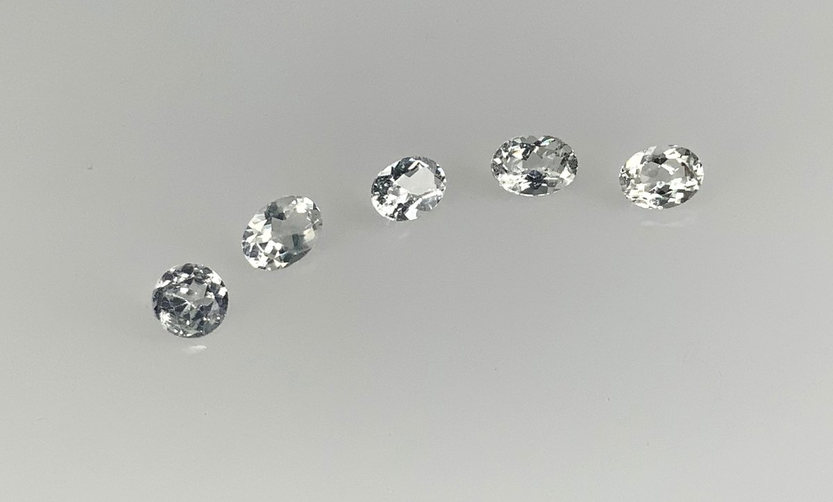 Loose Oval and Round Faceted Colorless Gemstones