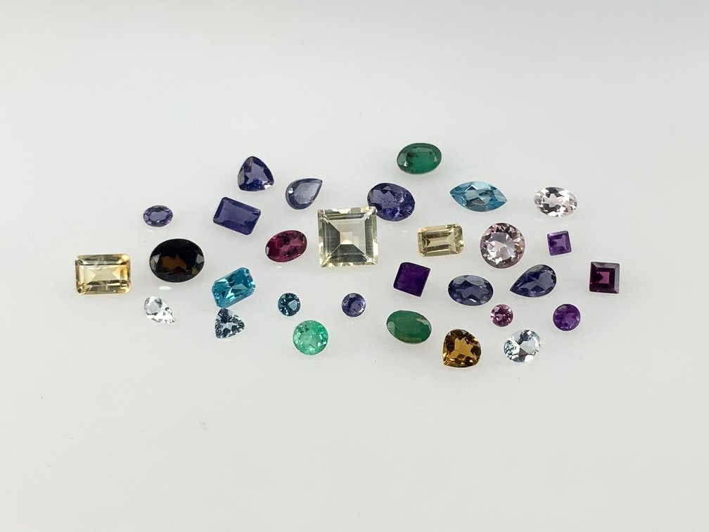 Thirty Loose Faceted Gemstones in Various Cuts