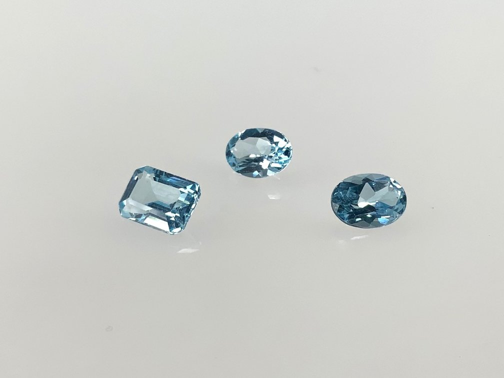 Three Loose Faceted Light Blue Gemstones