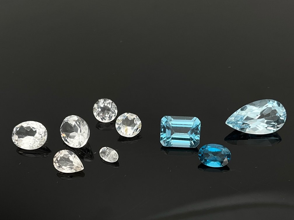 Nine Loose Faceted Topaz Gemstones