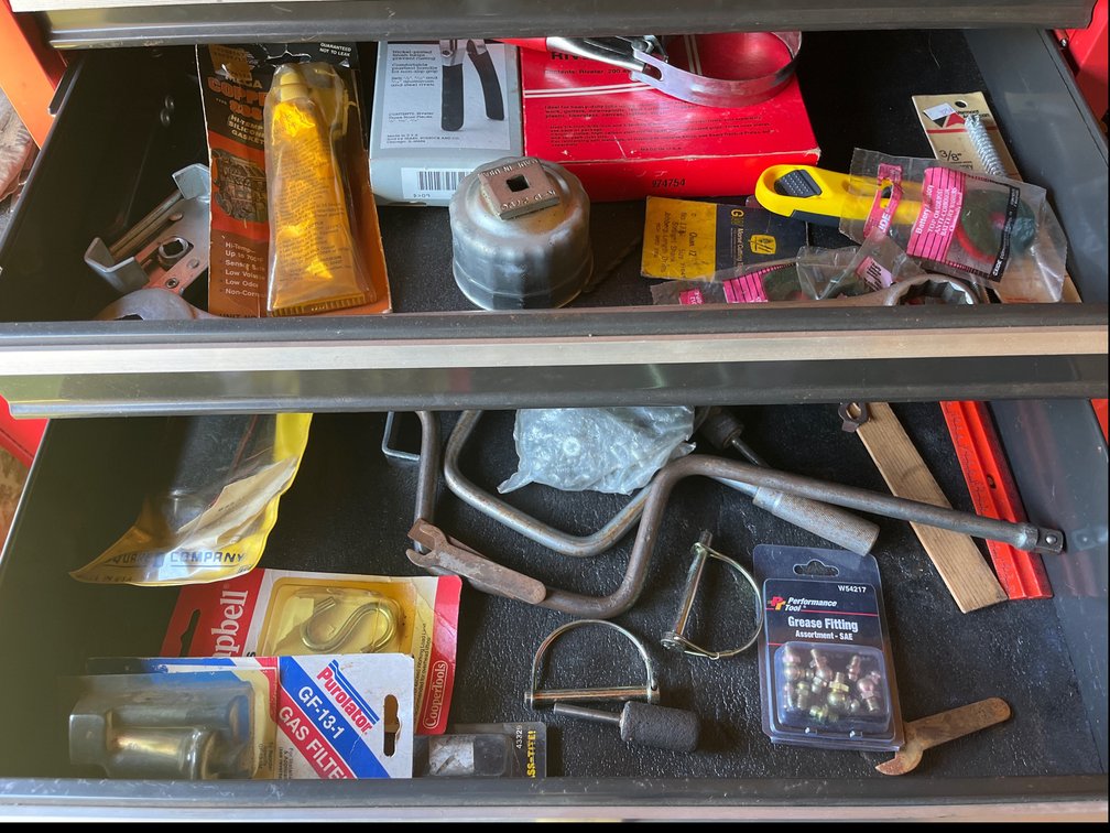 Lot of miscellaneous items including oil filter tool, chalk line, hand drill, & more