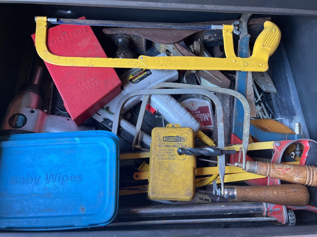 Lot of various hand saws, masonry drill bits, traditional drill bits, & more