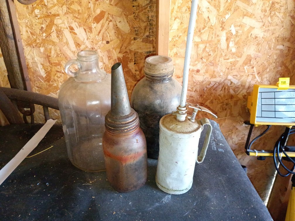 Vintage oil cans and jugs