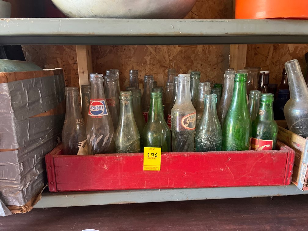 Shelf lot of miscellaneous vintage glass bottles