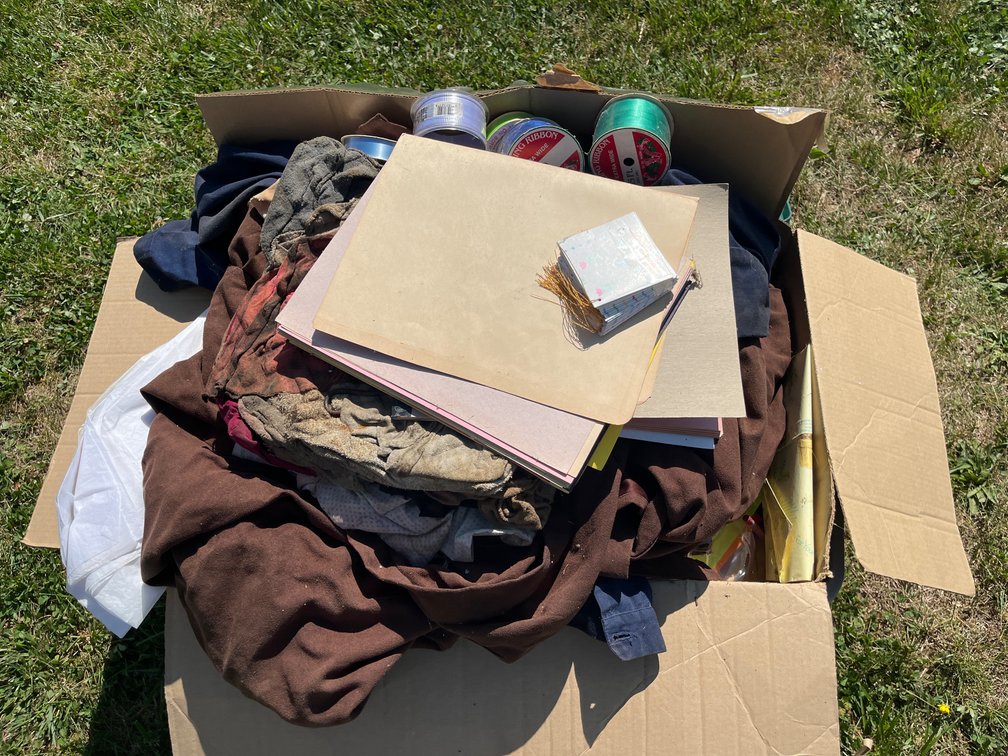 Tote full of miscellaneous fabrics, clothing, ribbon, & more