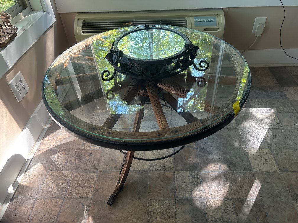 Antique wagon wheel glasstop table