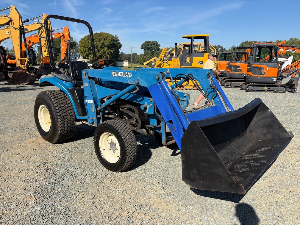Ford 1725 Tractor with New Holland 7308 front end loader *Read Description*