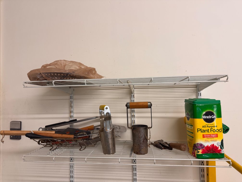 Shelf lot of gardening items