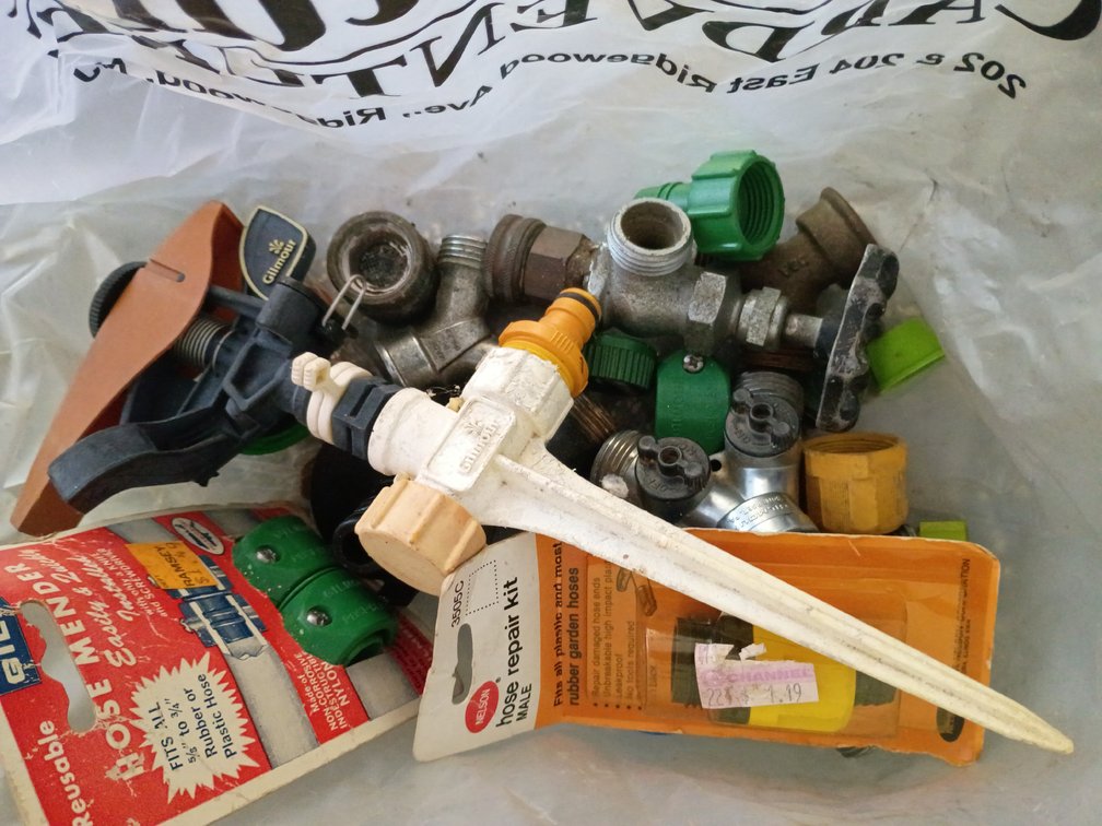 Bag Lot of Spigot and Water Hose Conny