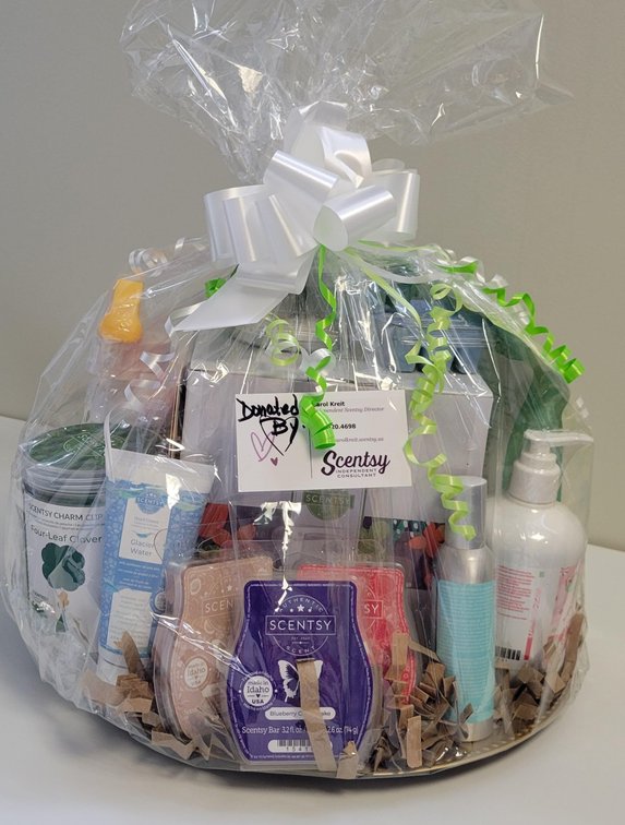 Scentsy Basket includes Flight of the Monarch warmer, four leaf clover charm clip, squeeze of the day counter cleaner, shoreline drive room spray, radiator springs air freshener circle, just breathe body soak, perfect peppermint hand soap, glacier water h