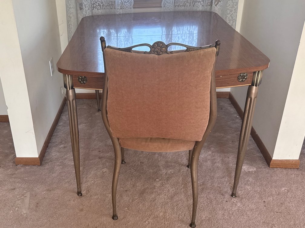 Vintage mid-century modern wood-grain and Formica top dining room table
