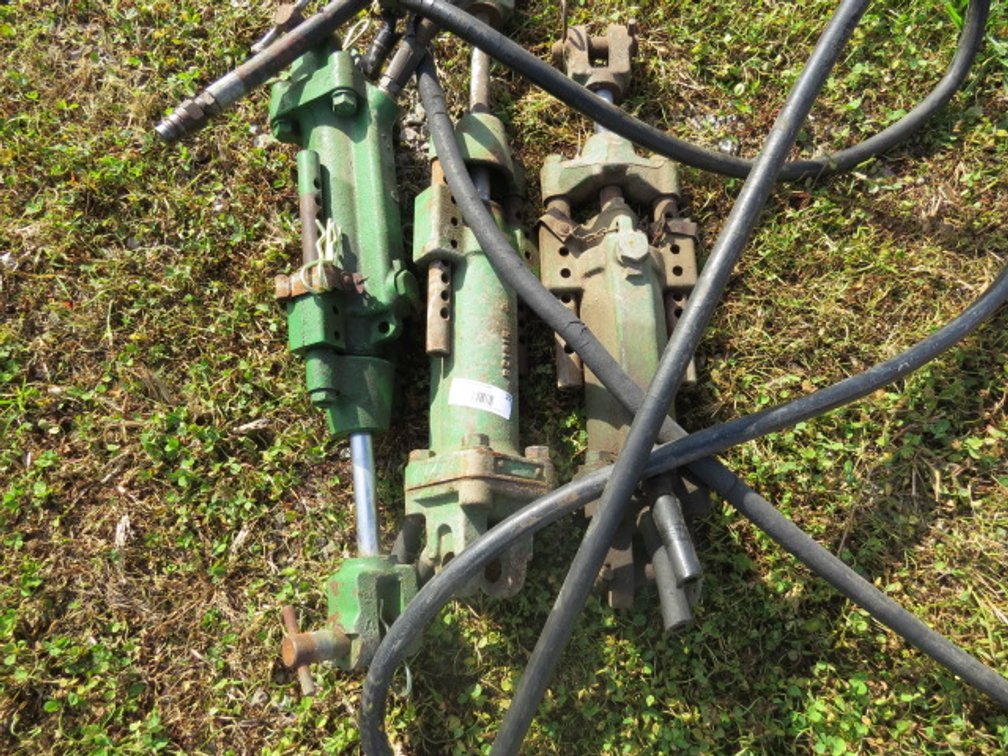 (3) Vintage "green" John Deere hydraulic cylinders