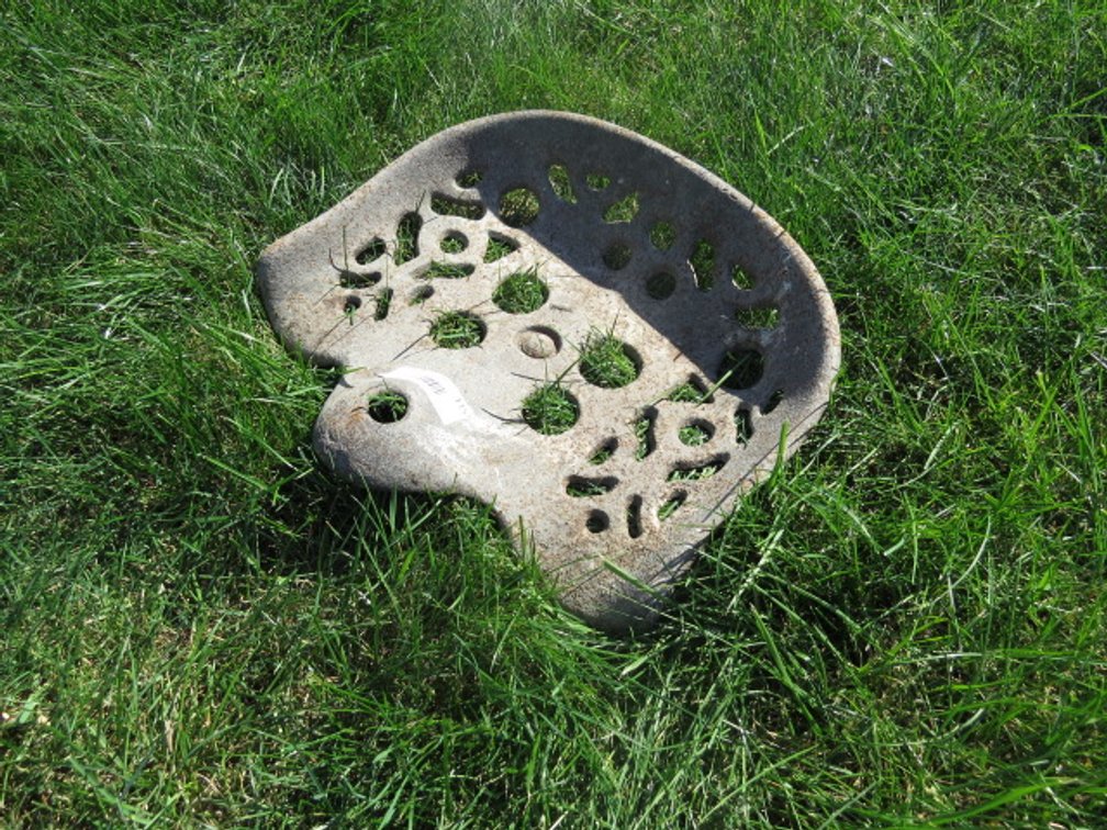 Antique cast iron tractor seat