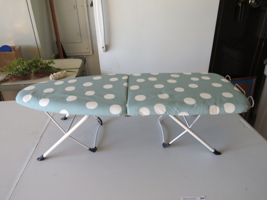 Minature folding ironing board