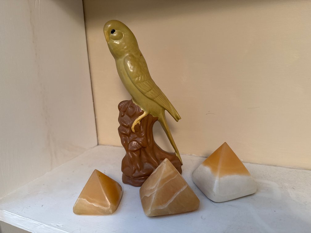 Ceramic Parakeet Figurine and Stone Pyramids