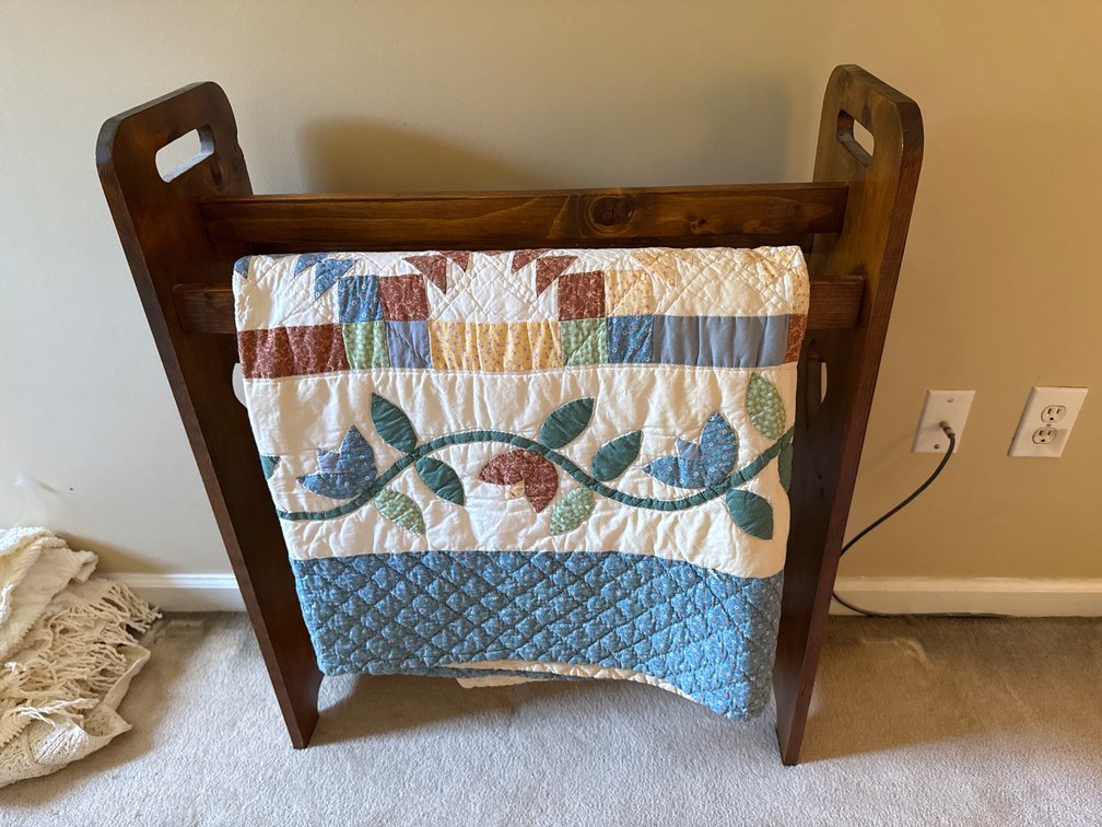 Wooden Quilt Rack and Patchwork Quilt