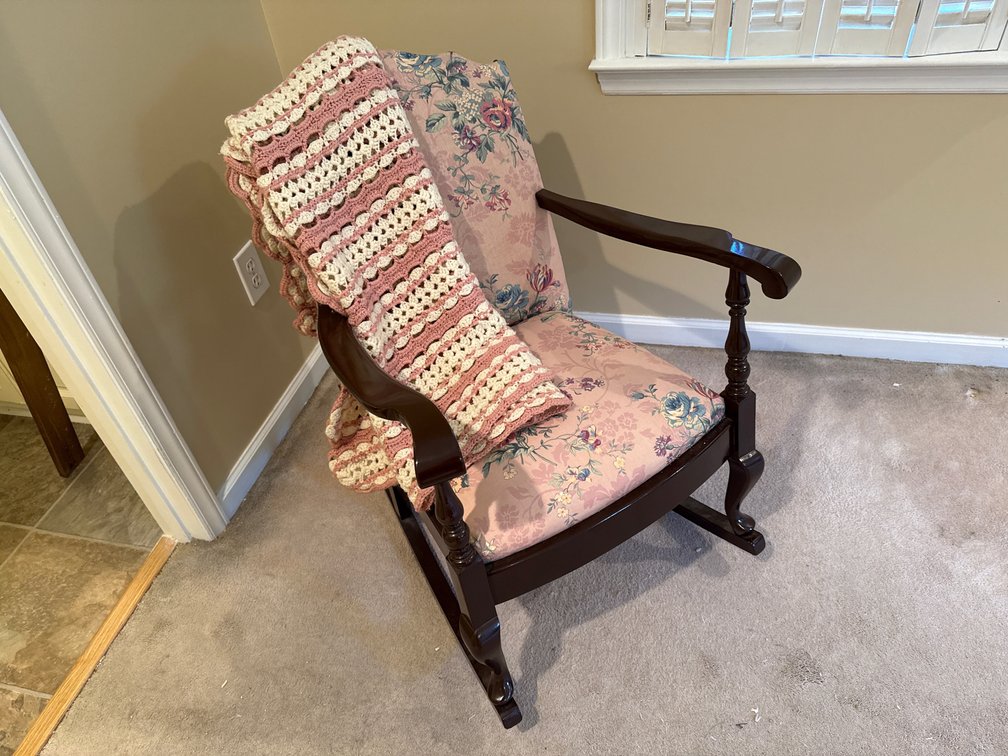 Floral Upholstered Rocking Chair & Crocheted Afghan
